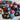 heart-shaped handpainted wooden pendants. The pendants are painted with various designs in blue, pink, green, red, and white. Each pendant has a pearl or gold bead on the pendant.