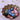 small brass bowl of handpainted wooden heart pendants each one painted with a different colorful design in shades of red, light blue, cobalt blue, dark green, pink, gold, and black. Patterns include mostly florals