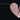 A picture of a pink paper heart hanging on a garland. The heart is torn down the middle, signifying heartbreak. It hangs on a pink and red string strung horizontally across the image.