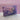 Purple box labeled 'Magical Girl Minis' on a glittery surface with a purple background